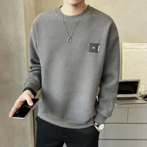 Suéter con texturizado, holgada con cuello redondo.