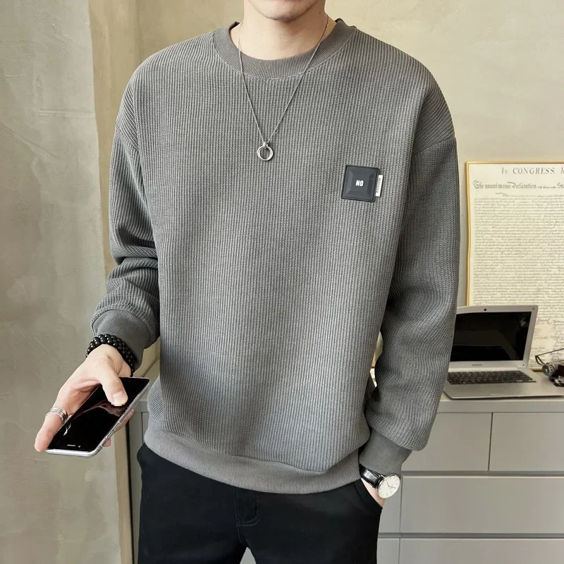 Suéter con texturizado, holgada con cuello redondo.