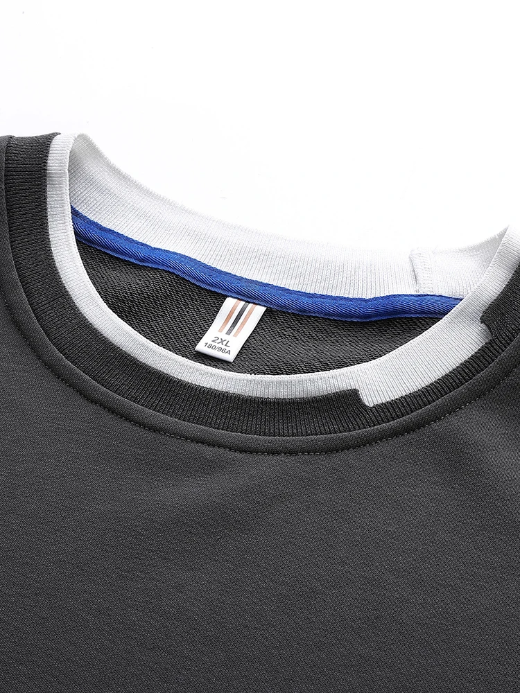 Suéter de cuello redondo con fondo de color sólido. - Image 5