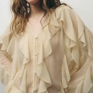 Blusas translúcidas con volantes, con cuello en V.