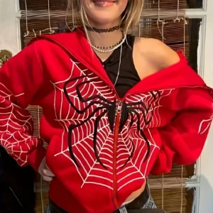 Suéter con cremallera de telaraña con capucha.